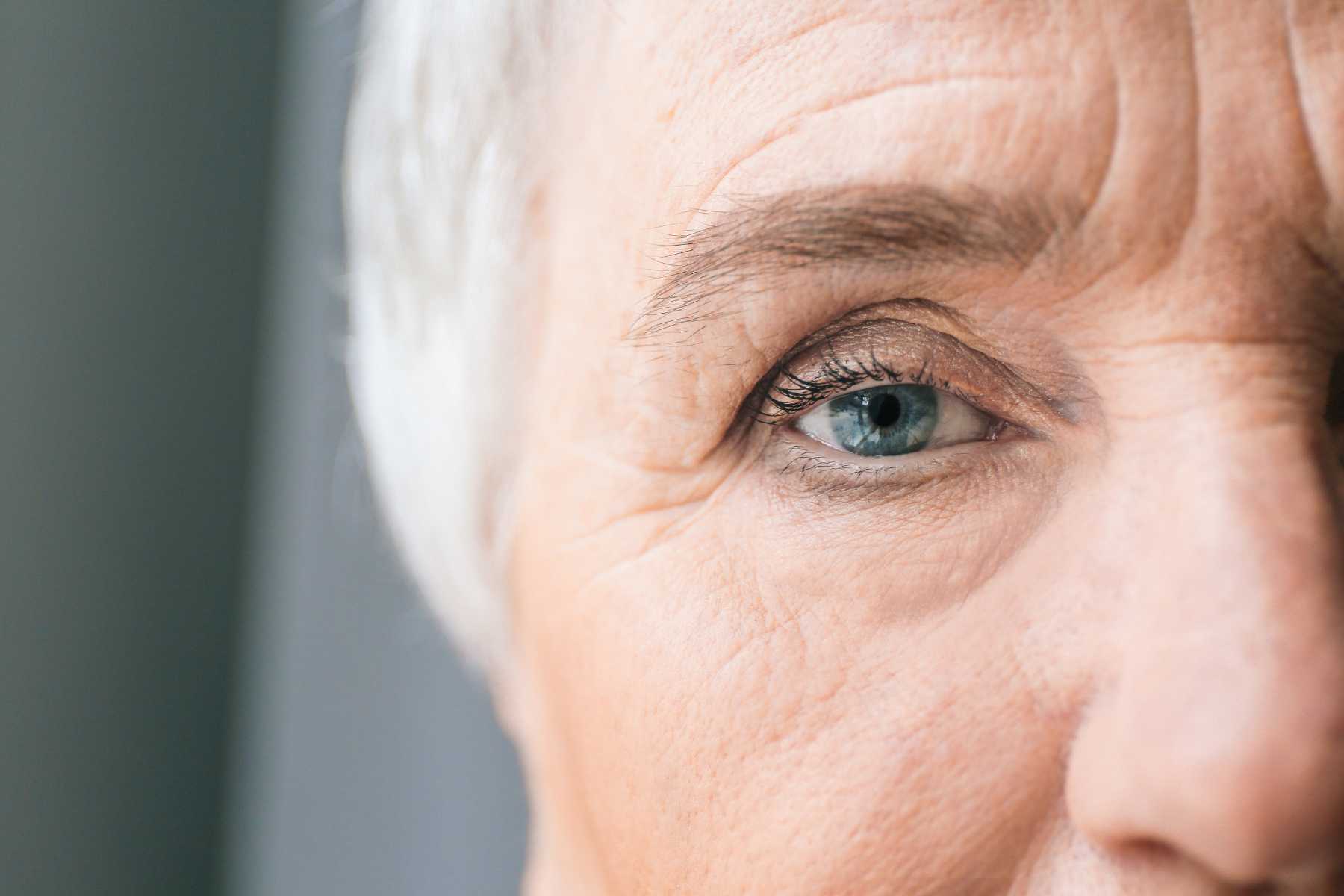 closeup of a older woman's face showing a few wrinkles