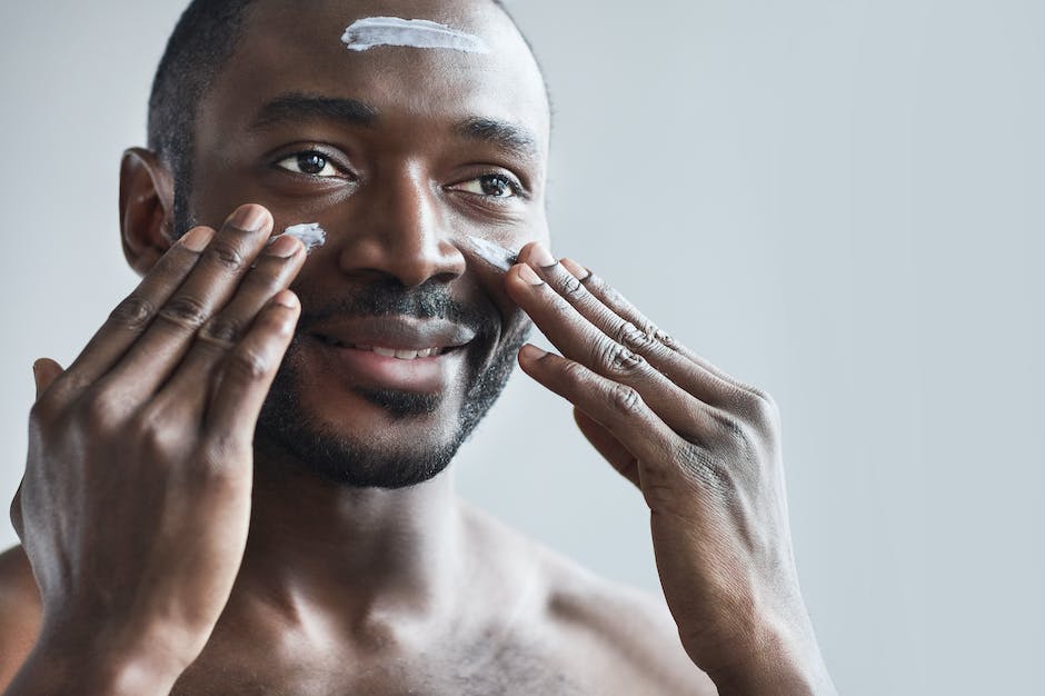 Image of a man applying anti-aging cream with dashes instead of spaces
