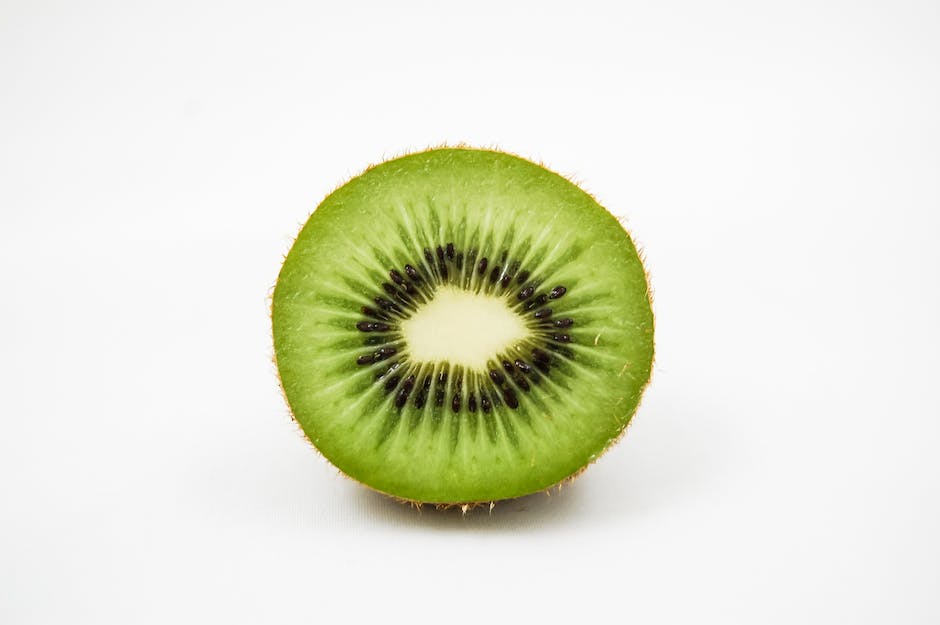 A close-up image of a kiwi fruit with dashes instead of spaces