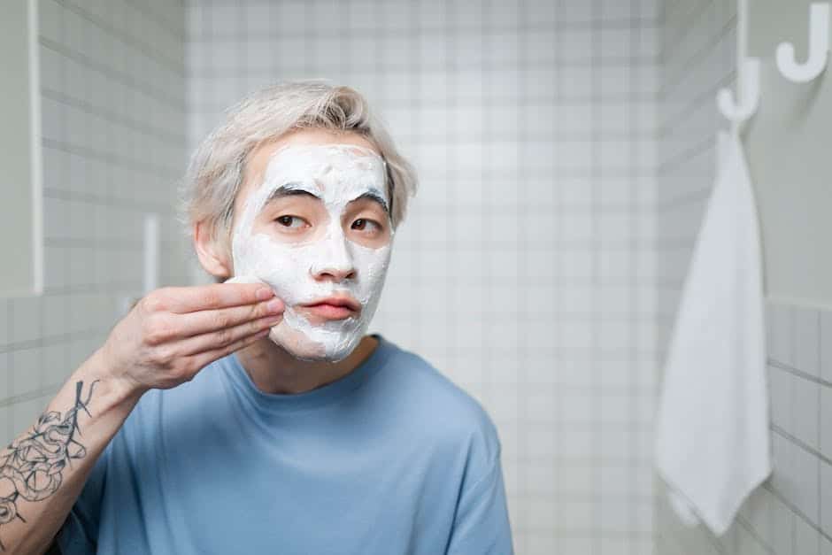 Image of a well-groomed man applying skincare products